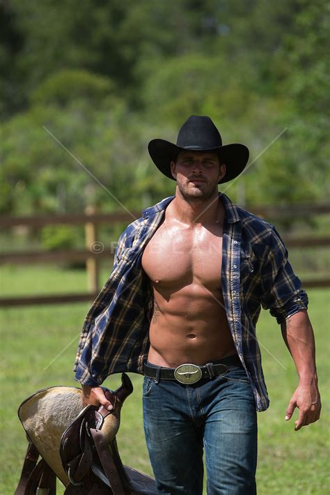 Hot Rugged Cowboy With An Open Shirt Walking On A Ranch Rob Lang