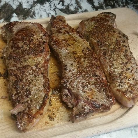 Place steaks in skillet and cook until just browned, 1 minute per side. New York Strip Steak