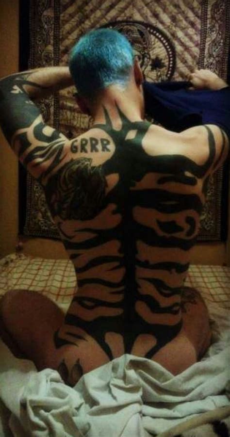 Tiger tattoos are popular with all gender identities. Tiger stripes tattoo on man back ( Tiger Miu) | Stripe ...