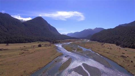 Mountains And River Landscape In Fiordland National Park New Zealand