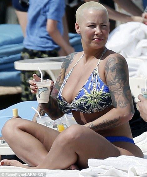 Latest Updates Amber Rose Shows Off Dangerous Curves As She Rocks Thong Bikini In Hawaii