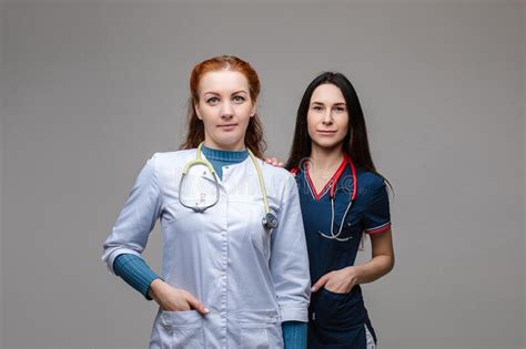 Two Professional Doctors With Stethoscopes Together Fighting Against
