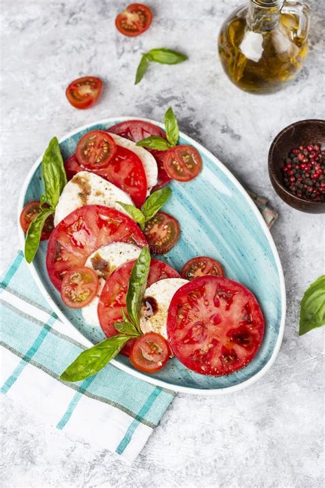 Italian Caprese Salad With Sliced Tomatoes Mozzarella Basil Olive