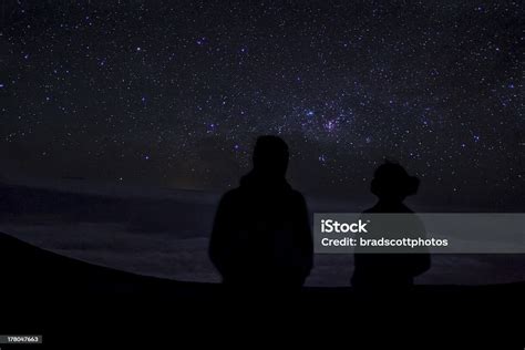 Silhouettes On Two People Star Gazing Stock Photo Download Image Now