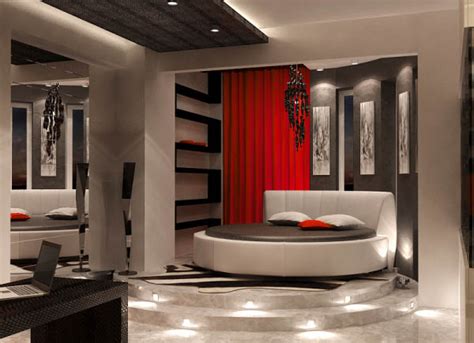 Fluffy high quality white bedding is a great way to soften out the darkness of black paint. Black and White Interior Decorating with Red Accents from ...