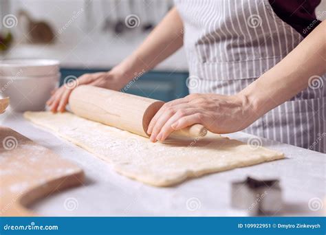 Young Female Rolling Out Dough On Kitchen Counter Stock Image Image