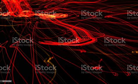 Red Luminous Lines On A Black Background Stock Photo Download Image
