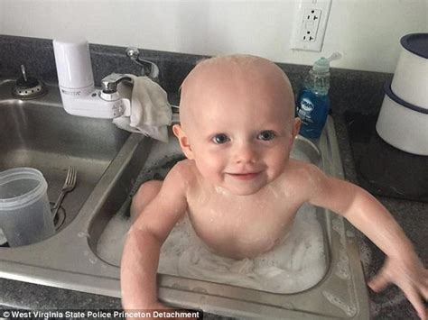Cops Rescue A Baby Covered In Vomit And Wash Him In Their Sink At The
