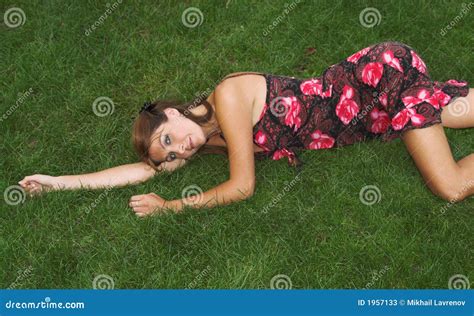 pretty brunette lying on the grass stock image image of brunette laying 1957133
