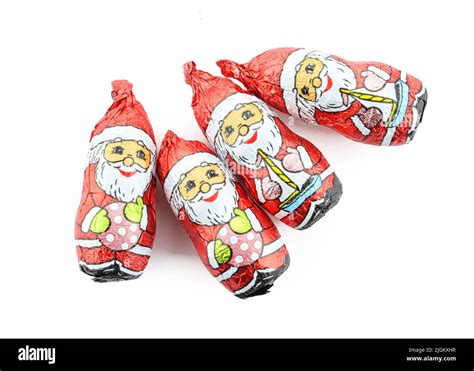 Group Of Chocolate Santa Claus Figures Wrapped In Foil Isolated On