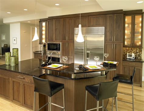 Simply stunning walnut kitchen topped with amazing curved corian clamshell worksurfaces. Walnut Kitchen - Contemporary - Kitchen - charlotte - by ...