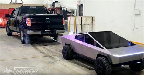 Watch A Half Scale Cybertruck Beat A Ford F 150 In A Tug Of War