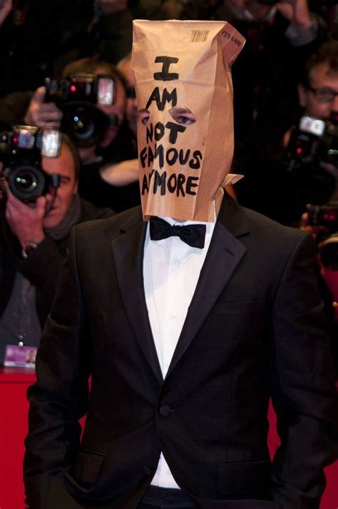 A Man In A Tuxedo With A Paper Bag On His Head That Says I Am Not