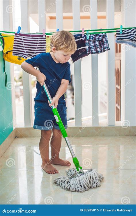 Kid Boy Cleaning Room Washing Floor With Mop Little Home Helper Stock