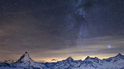 Snow Covered Mountain Under Sunset Sky With Blue Stars Hd Space