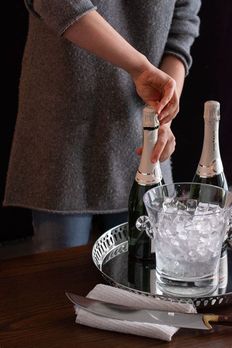 How To Saber A Champagne Bottle | Champagne bottle, Bottle, Wine bottle