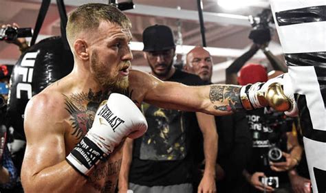 Two division ufc world champion. McGregor Mayweather: Eight-ounce gloves approved...but ...