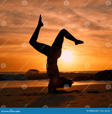Yoga Silhouette Or Handstand On Sunset Beach Ocean Or Sea In Evening