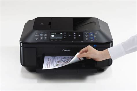 Fill the ink cartridge and then load paper into your printer tray. PIXMA MX882