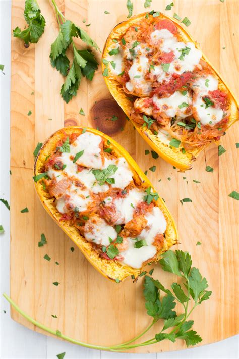 Chicken parmesan stuffed spaghetti squash is a much healthier but still delicious version of your favorite chicken parm. Cheesy Chicken Spaghetti Squash Boats | Heart & Stove