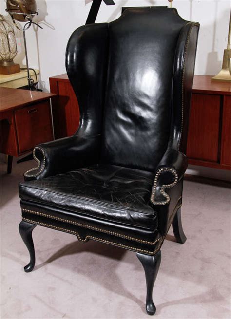 What type of assembly is required. Vintage Black Leather Wing Chair at 1stdibs