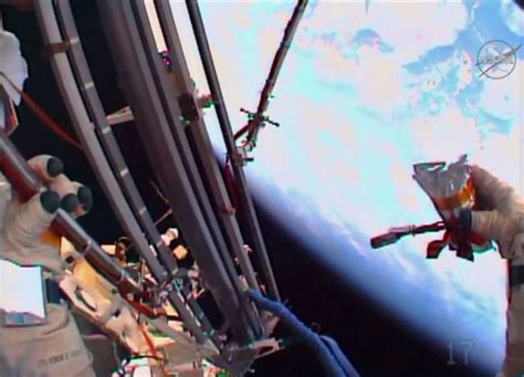 Russian Spacewalkers Maintain Experiments Launch Ceremonial Flash