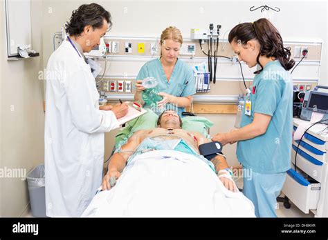 Doctor Treating Patient Hi Res Stock Photography And Images Alamy