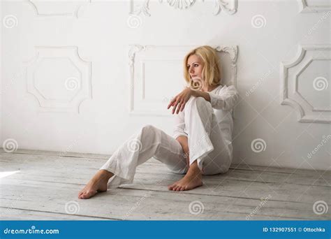 Beautiful Blond Woman Sitting On The Floor Barefoot Stock Image Image