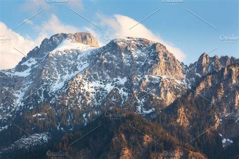 Snowy Mountain Peaks At Sunset Containing Mountain Rock And Landscape