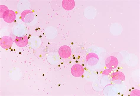 Pink Confetti And Stars And Sparkles On Pink Background Stock Photo