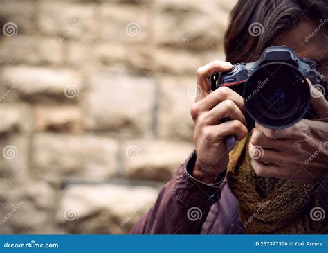 Photography Is My Passion A Handsome Young Photographer At Work In The