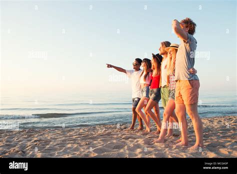 Group Of Happy Friends Having Fun At Ocean Beach Stock Photo Alamy