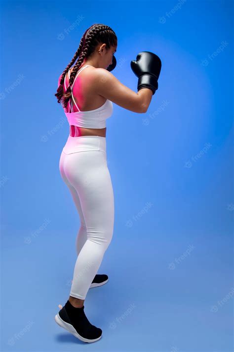 free photo full shot woman wearing boxing gloves