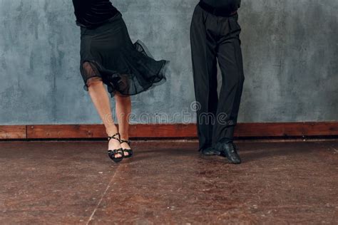 Legs Of Young Couple Boy And Girl Dancing In Ballroom Dance Jive Stock