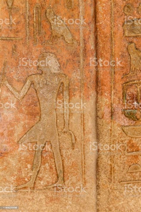 Ancient Egyptian Paintings And Hieroglyphs Carved On The Stone Wall
