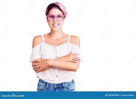 Young Beautiful Woman With Pink Hair Wearing Casual Clothes And Glasses Happy Face Smiling With
