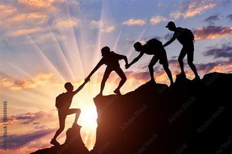 Men Climbers Help Each Other In The Mountains Stock Photo Adobe Stock