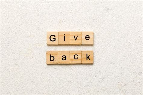 Give Back Word Written On Wood Block Give Back Text On Table Concept