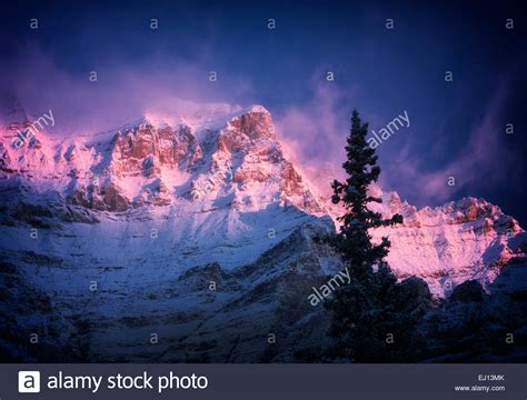 First Light On Mountain Surrounding Moraine Lake With Fresh Snow