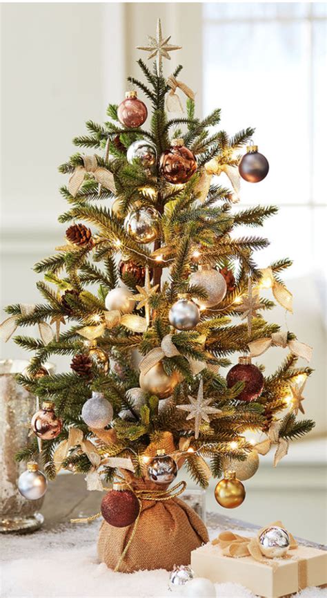 Take the end of the the cord, pull it toward you, then loop it over the hoop and pull to the left. 50 DIY Mini Christmas Trees - Prudent Penny Pincher