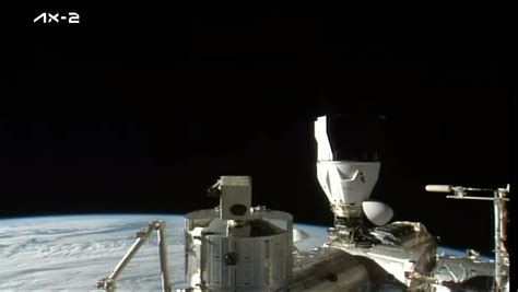Spacex Dragon Capsule Docks At Space Station With
