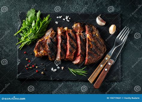 Sliced Steak Ribeye Grilled With Pepper Garlic Salt And Thyme Served