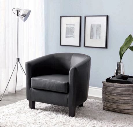 Founded on a solid and manufactured wood frame, this swivel barrel chair strikes a classic silhouette with an arched back, flared track arms, and a thick padded seat. hometrends Faux Leather Accent Chair | Walmart Canada