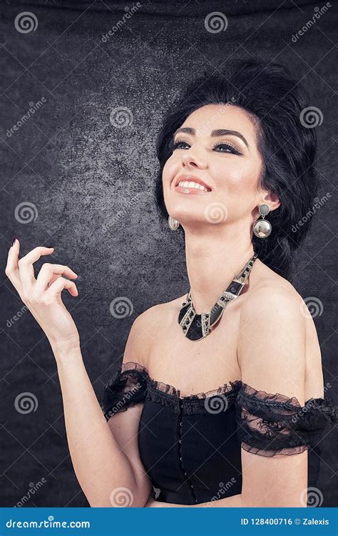 Sensual Brunette Model Retro Styled Looking Up And Smiling On B Stock
