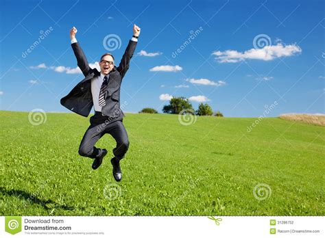 Excited Businessman Jumps High In The Air Stock Photo Image Of