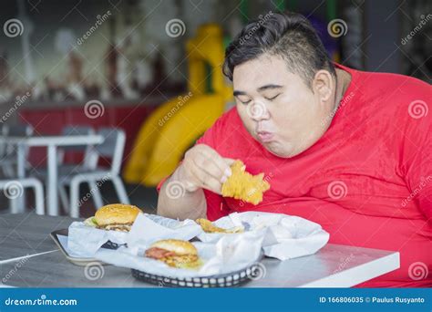 portrait of fat asian man chewing all foods stock image image of indoor food 166806035