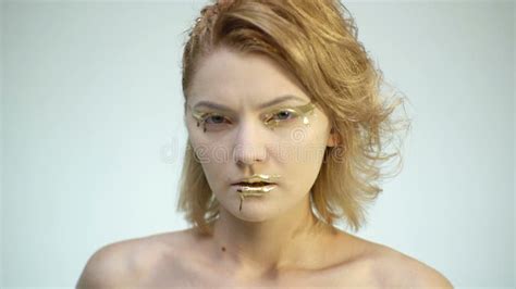High Fashion Body Art Woman With Golden Skin And Lips Model Girl And Boy Face Portrait Stock