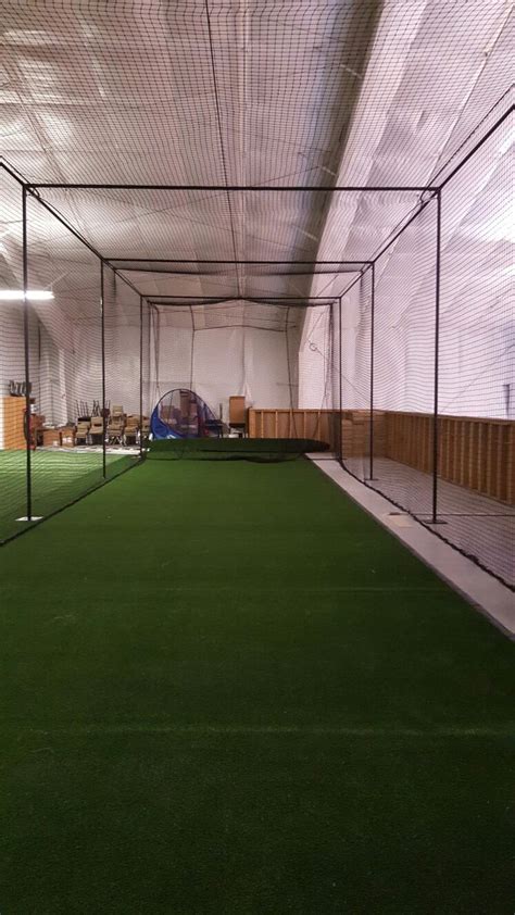 batting cage installed on flanges foot pads pelota