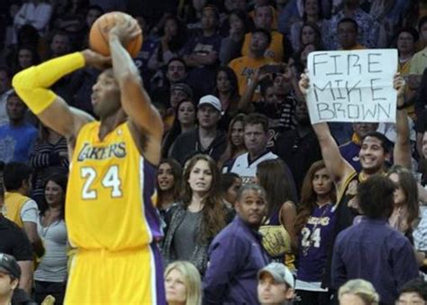 Never cuddly, he could be ruthless to his underperforming teammates. Laker Fan holds up a Fire Mike Brown sign as Kobe Bryant ...