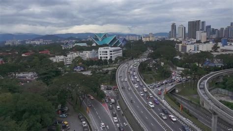 Driving during rush hour can be frustrating, especially in busy areas. KUALA LUMPUR - JAN 18: Traffic Jam During Peak Hours Near ...